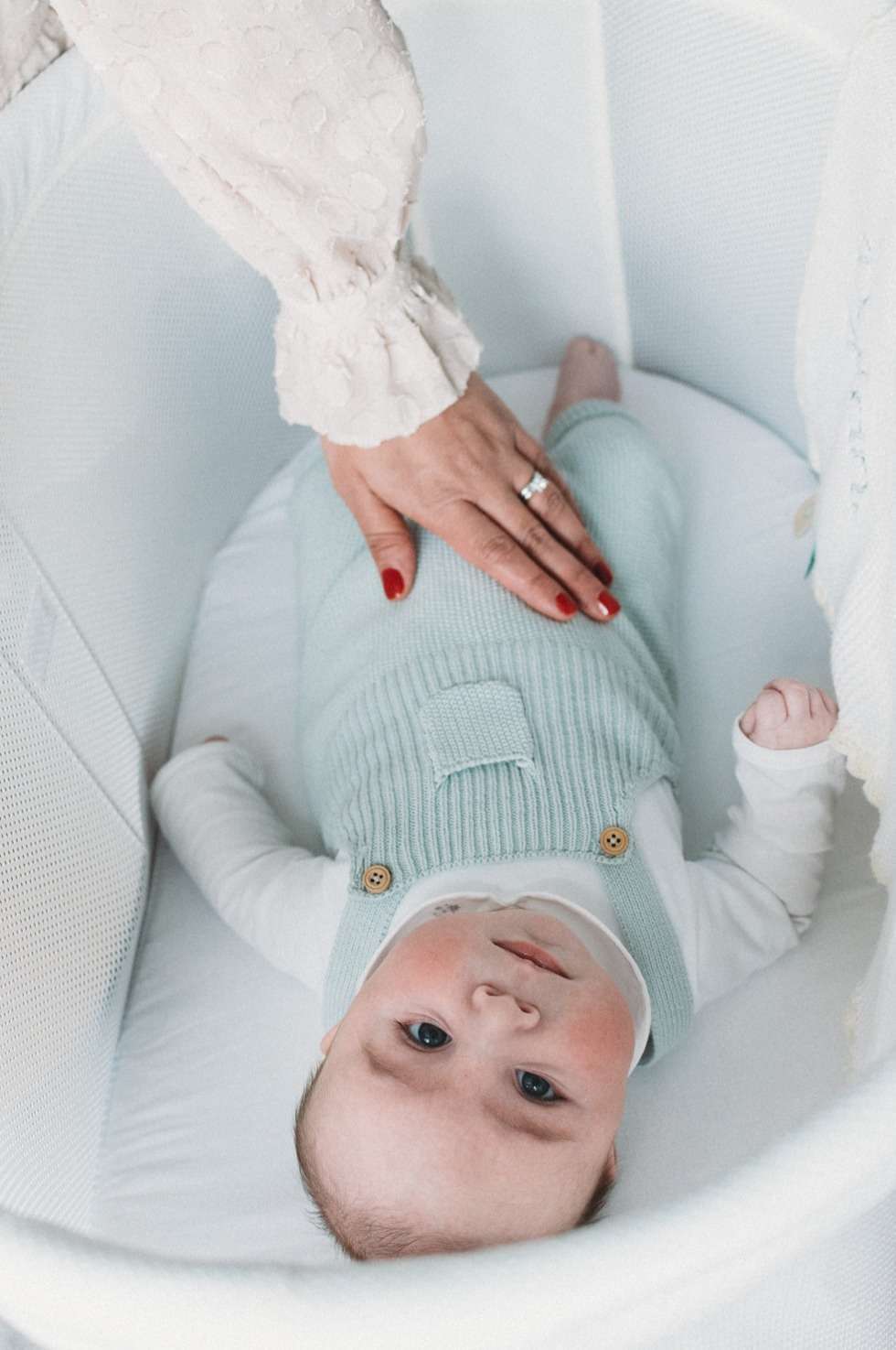 Older Baby Photography Southgate North London. Natalie Avery Photography-22 North London Family Photography - 3 month old baby in moses basket with mums arm stroking him